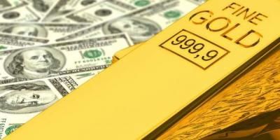 الذهب يتراجع متأثراً بقوة الدولار
